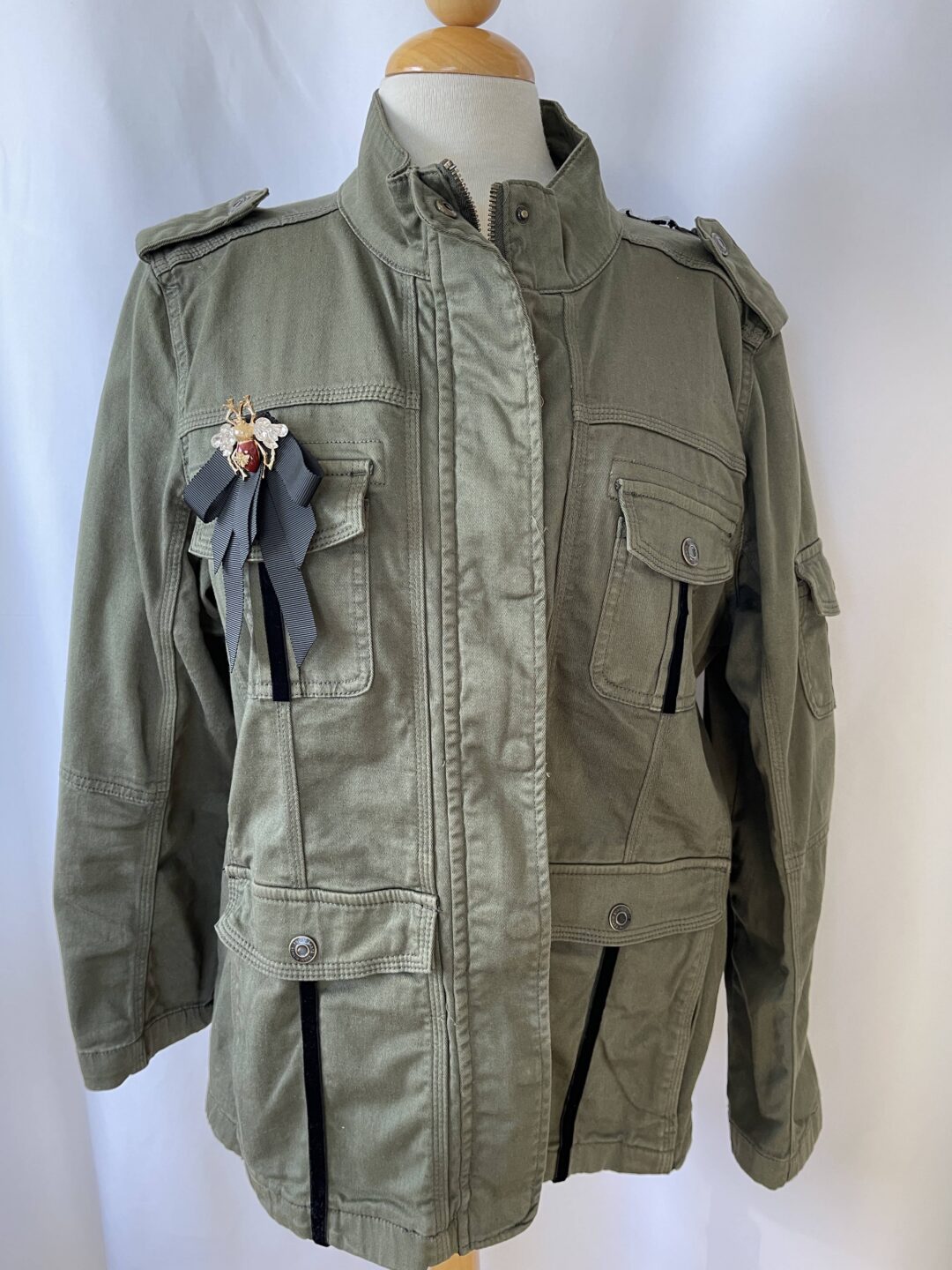 Olive green military jacket with ribbon brooch