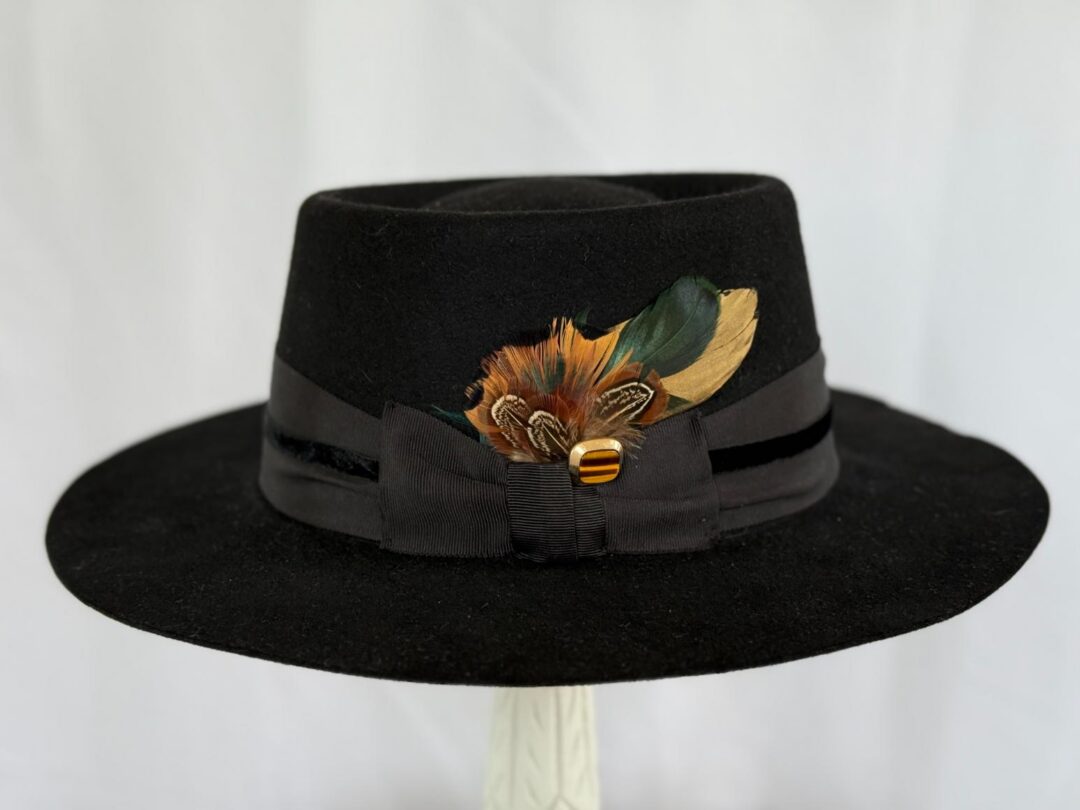 Black fedora with ribbon and feather decoration